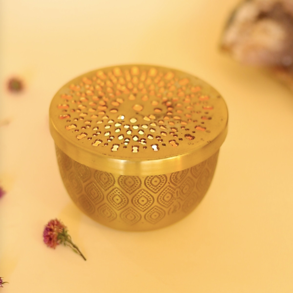 Tara - Soy wax scented candle flickering under its lid and adding to the festive vibes